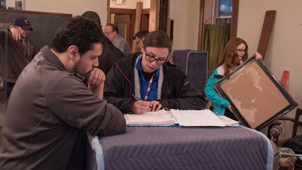 Students from a public history class work on a display at the Newport History Museum at Southgate Street School.