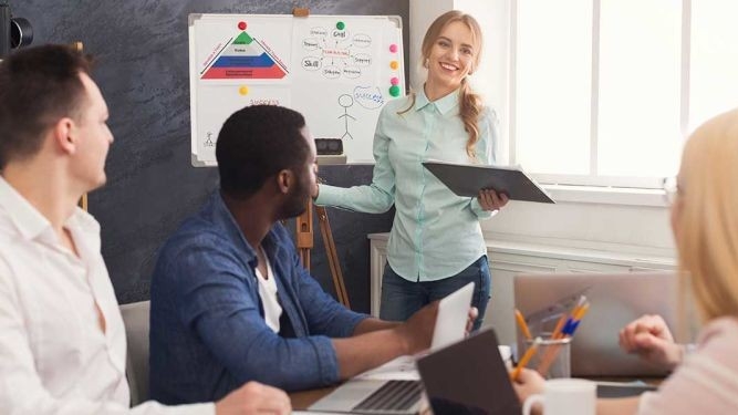 An instructor leads a class in a training exercise