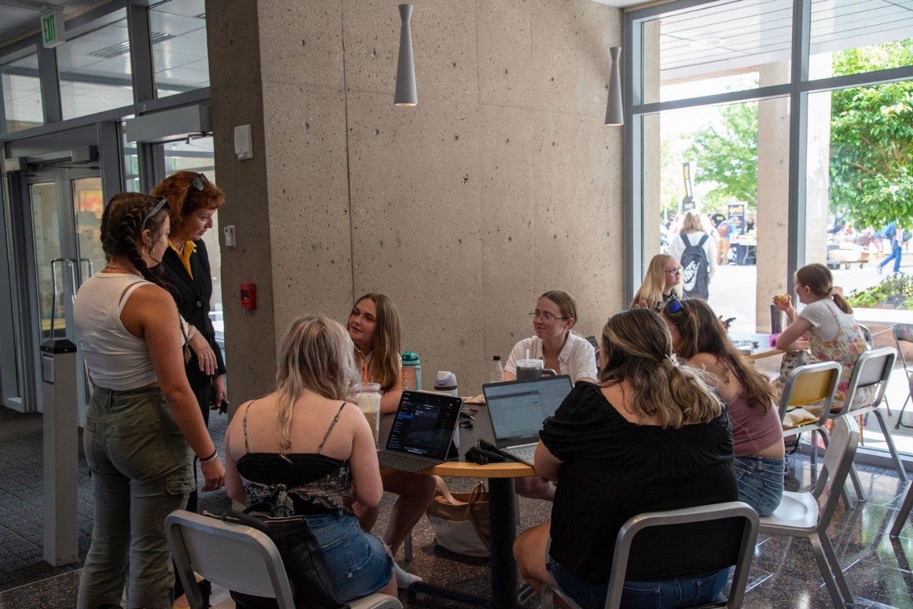 Dr. Cady Short-Thompson talking to students in Student Union